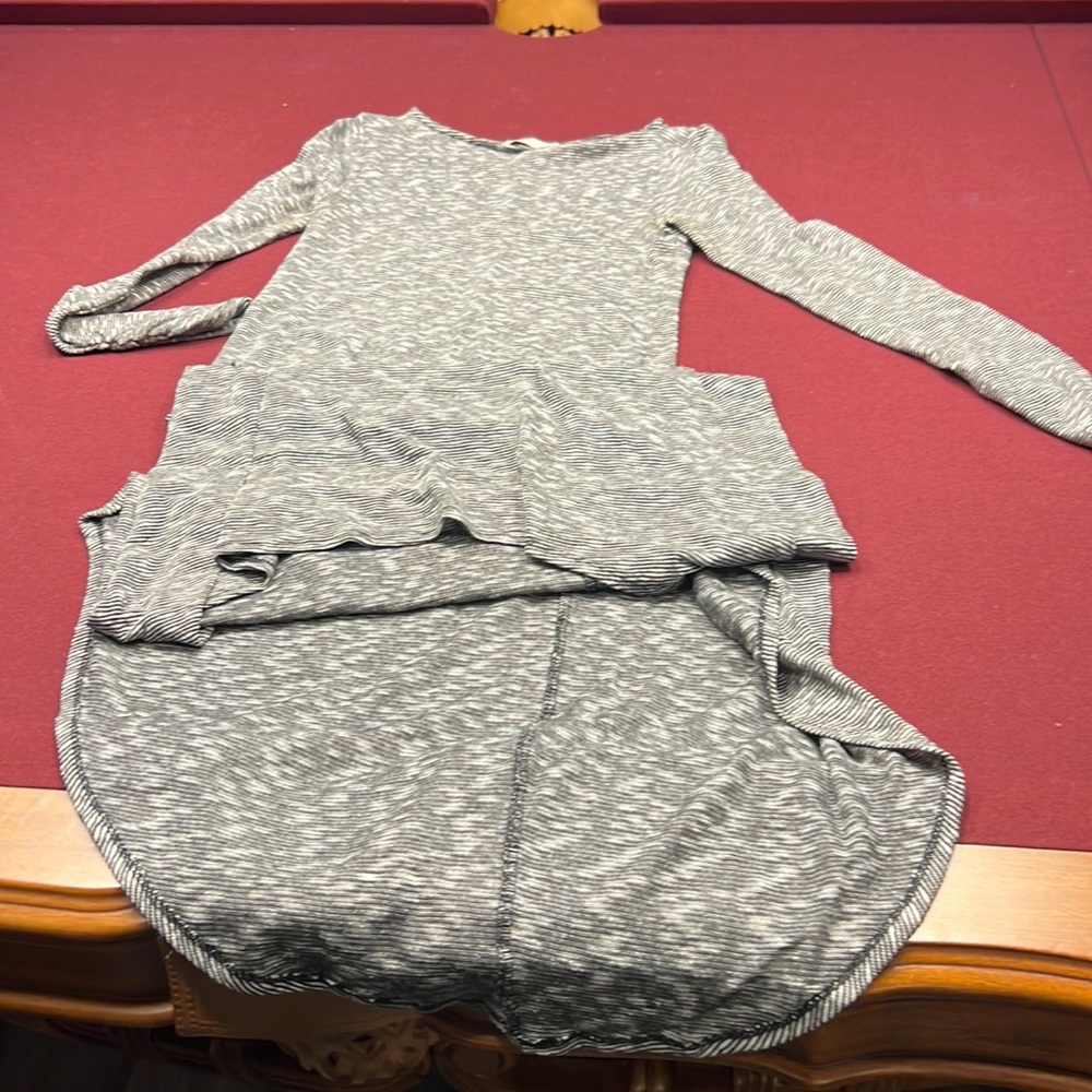Form fitting dress longer in back